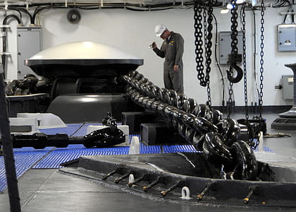 person standing near black steel chain thumbnail