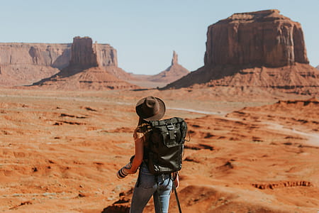 woman walking towards the mountain thumbnail