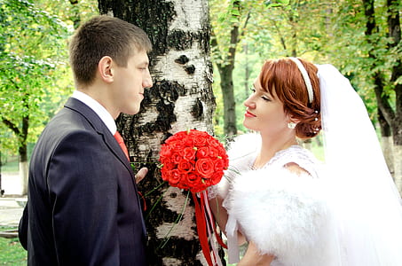 man and woman near tree thumbnail