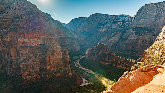 brown rock formation mountains under blue sky thumbnail