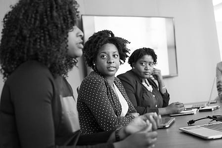 Woman Discussing With Her Colleagues thumbnail