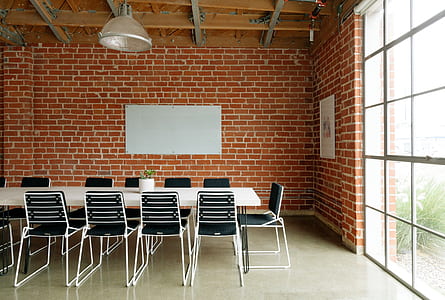 white metal chairs in front of table thumbnail