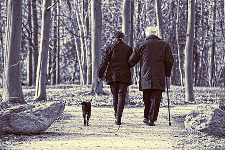 man walking on gray pathway thumbnail