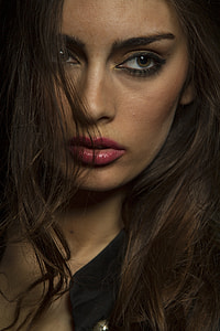 woman in black shirt close up photography thumbnail