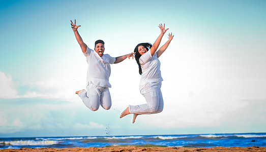 jump shot photography of two person near body of water thumbnail
