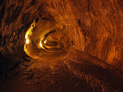photo of empty brown cave with turned on tunnel lights thumbnail