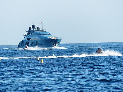 two personal watercraft near yacht thumbnail