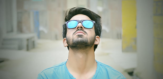 man wearing blue crew-neck shirt thumbnail