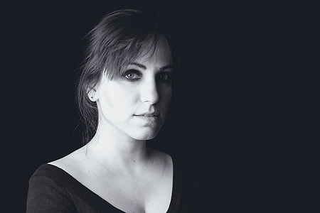 grayscale photography of woman in black scoop-neck top posing for photo thumbnail