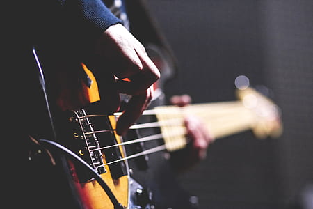 person playing bass guitar thumbnail