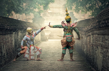 two people wearing costumes during day thumbnail
