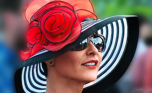 selective focus photography of woman wearing sunglasses and sun hat thumbnail