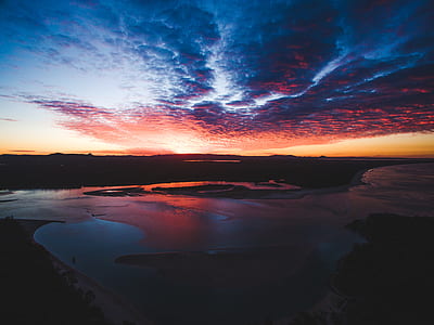 White Sand Beach Under Cloudy Sky during Sunset thumbnail
