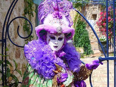 person wearing masquerade mask and costume thumbnail