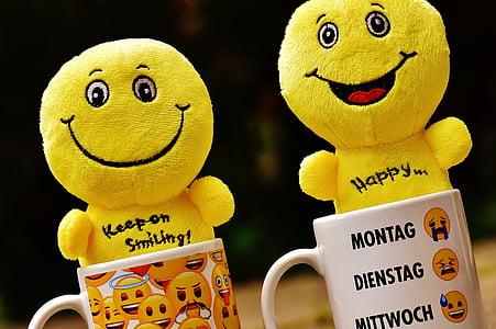 two emoticon plush toys on coffee mugs thumbnail
