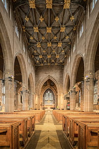 brown wooden pew chairs inside church thumbnail