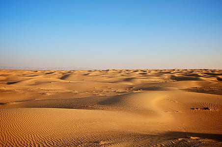 brown sand under blue sky thumbnail