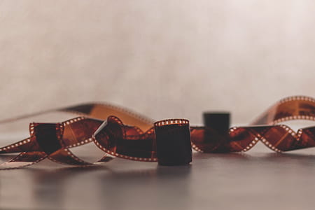 closeup photo of camera film on white surface thumbnail