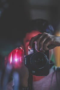 Person Holding Black Canon Dslr Camera thumbnail