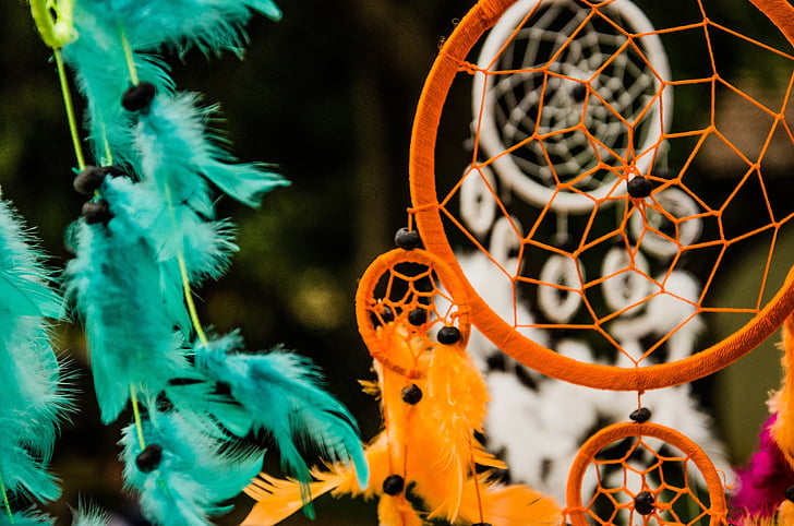 selective photography of hanged dream catchers