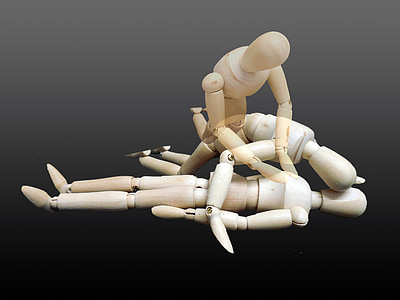 beige marionette on black surface thumbnail