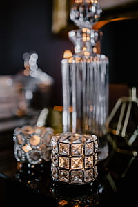 Decanter, candles, and a painting on the wall thumbnail