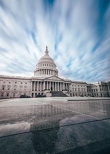 white concrete structure under cloudy sky thumbnail