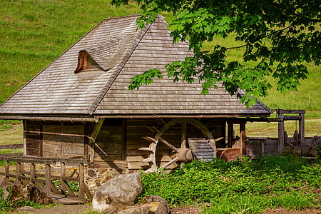 brown wooden house with mill thumbnail