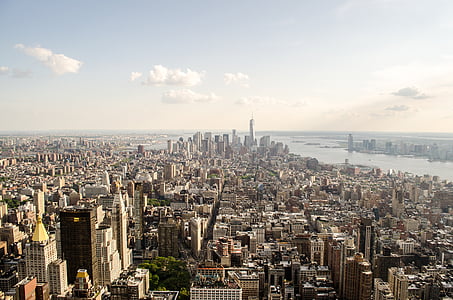 aerial photography of high rise building across body of water during daytime thumbnail