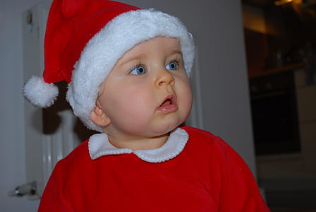 toddler wearing santa hat thumbnail