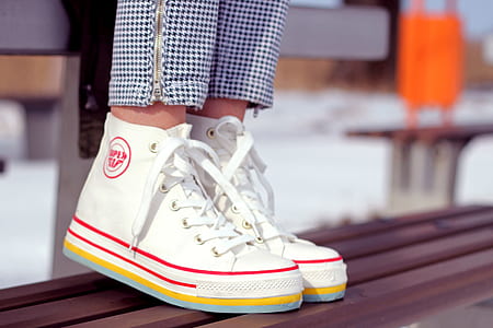 person wearing high-top sneakers thumbnail