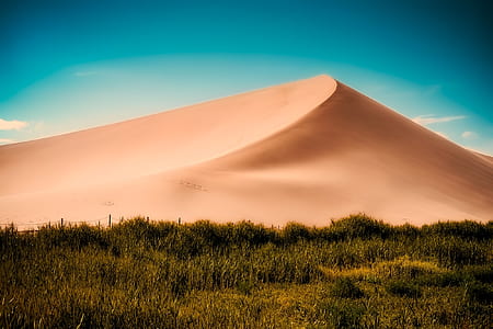 sand mountain and grass field thumbnail