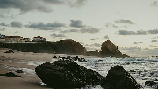 gray rock formation near coastline thumbnail