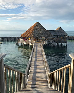 gazebo surrounded with body of water thumbnail