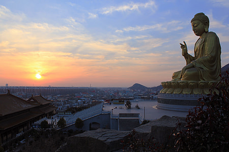 Buddha watching over the city at sunset in Thailand thumbnail