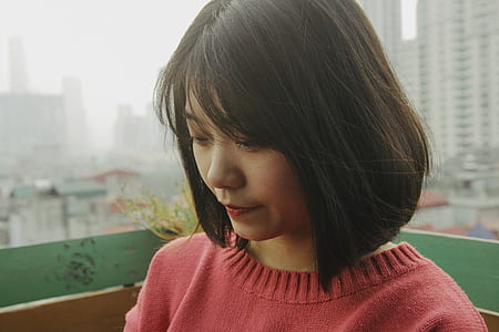 woman wearing red crew-neck sweater thumbnail