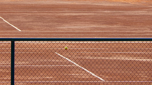 green tennis ball in court thumbnail