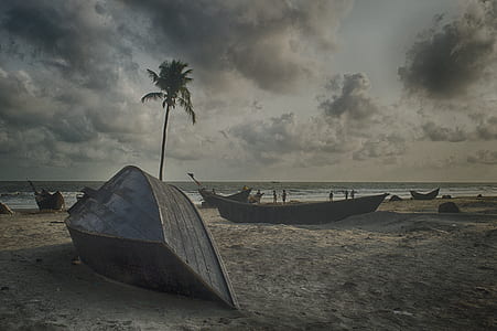 Gray Boat on Gray Sand Beach Under Gray Cloudy Sky thumbnail