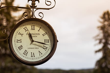 round black Padington clock at 11:18 thumbnail