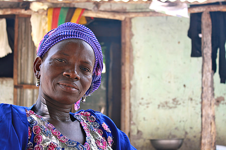 woman wearing purple headscarf and blue dress thumbnail