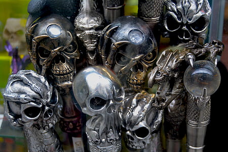 photo of silver and gold-colored skull accessory lot thumbnail
