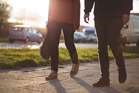 two men walking on pathway thumbnail