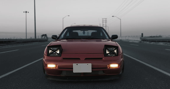 selective color photography of red car thumbnail