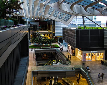 group of people standing inside concrete building interior thumbnail