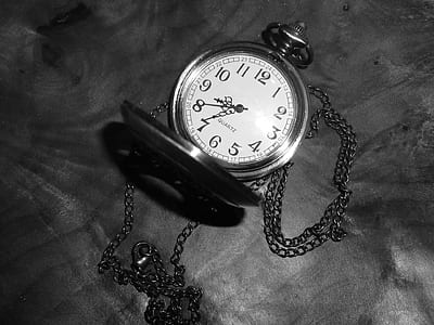 silver-colored pocket watch thumbnail
