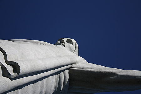 low angle photography of Christ the Redeemer under blue sky thumbnail