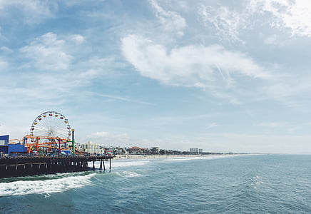 Ferris Wheel near body of water under white sky thumbnail