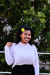 Smiling Woman Wearing White Long-sleeved Blouse thumbnail