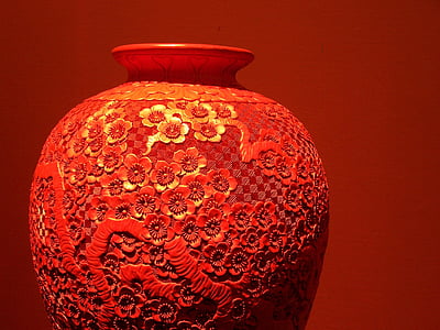 focus photo of red floral ceramic vase thumbnail