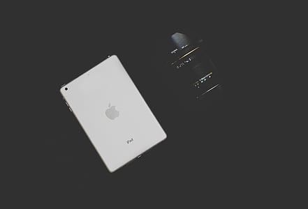white iPad and black bridge camera thumbnail